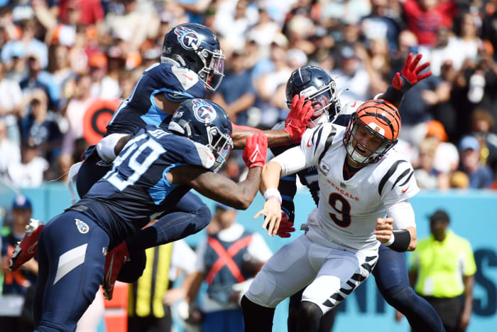 Cincinnati Bengals quarterback Joe Burrow (9) throws the ball ahead of pressure during the first half against the Tennessee Titans at Nissan Stadium.